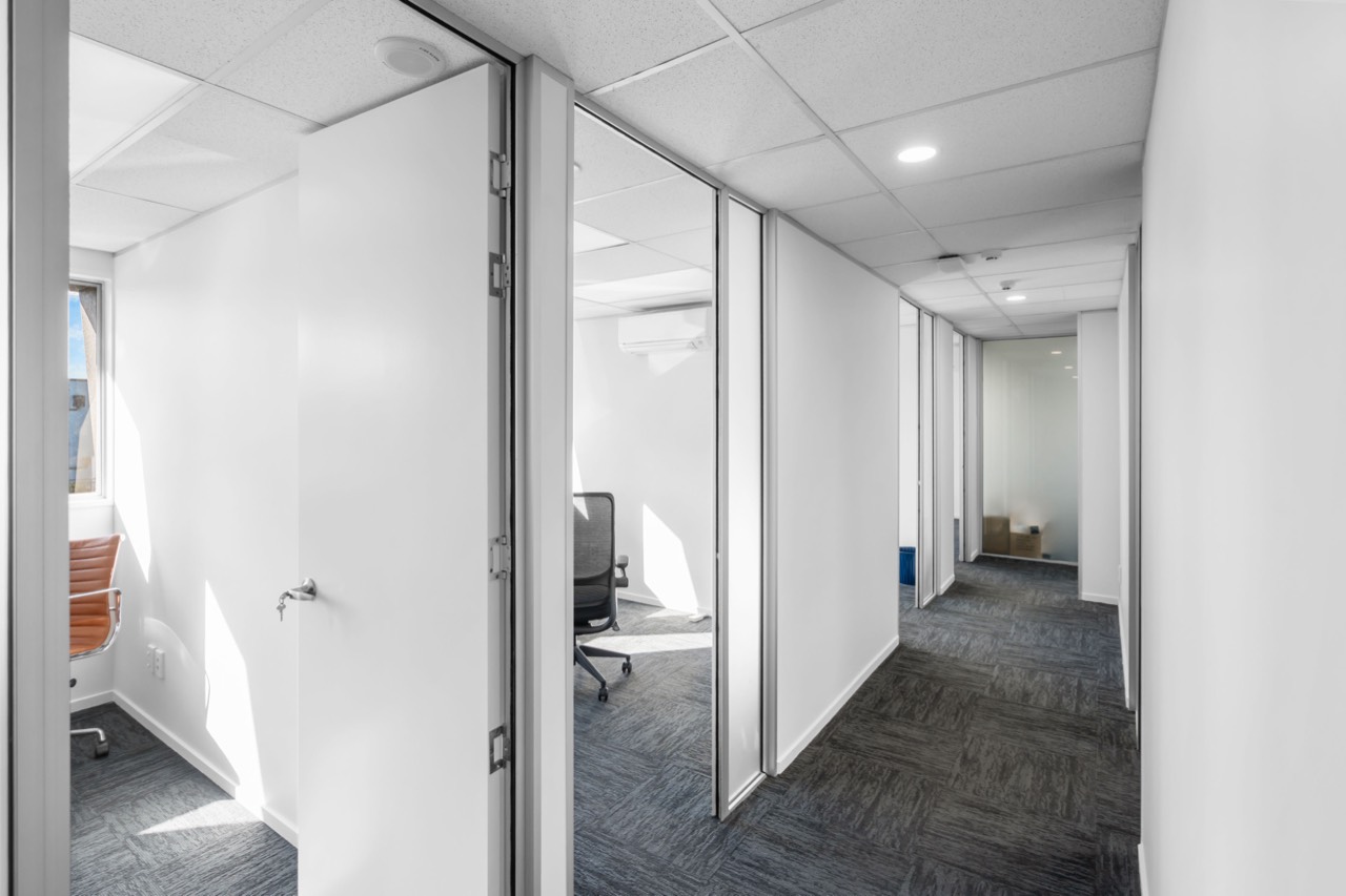 The corridor of studios with glass-panelled doors